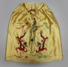Padded cloak with hood and dragon motifs